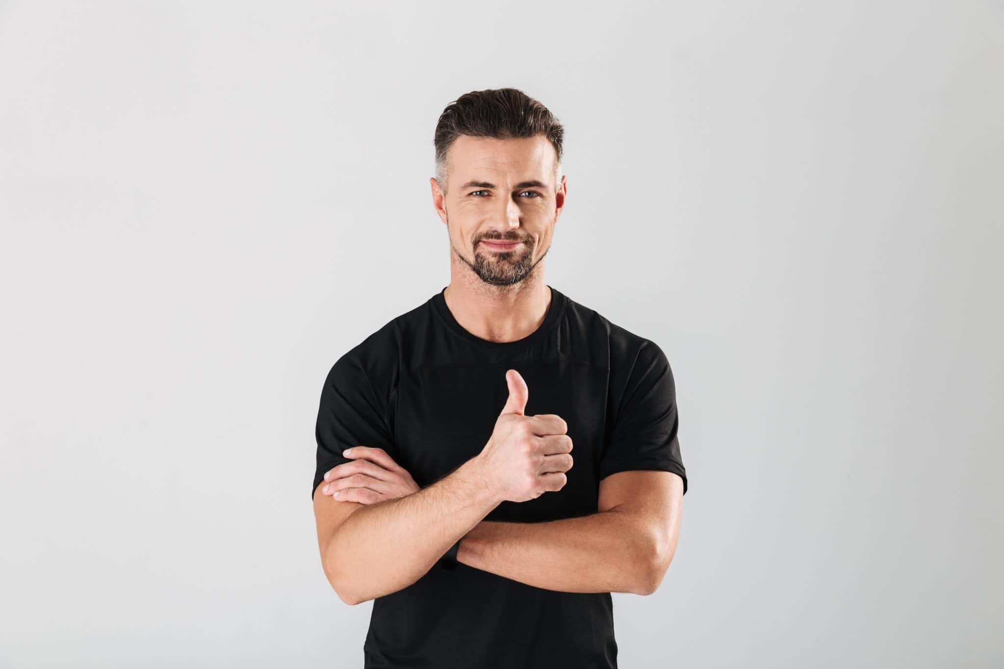 Smiling man with thumbs up sign image